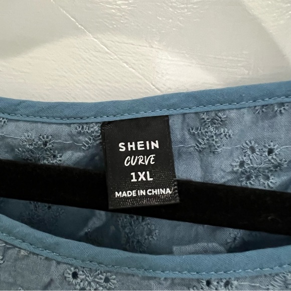 Blue Eyelet Embroidery Button Back Asymmetrical Blouse - Picture 6 of 8